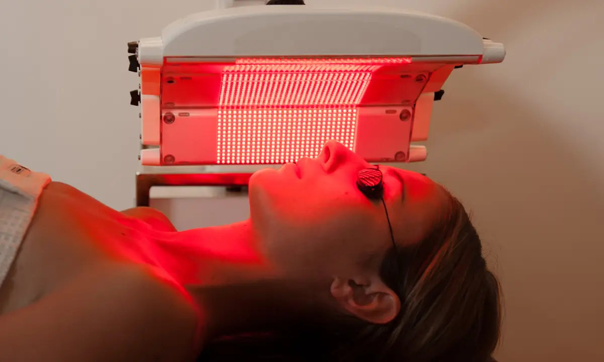 Close-up of a patient receiving anti-aging red light therapy to reduce wrinkles in Fairfax, VA